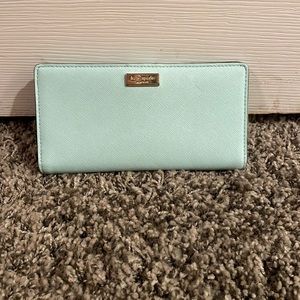 moderately worn light blue kate spade wallet